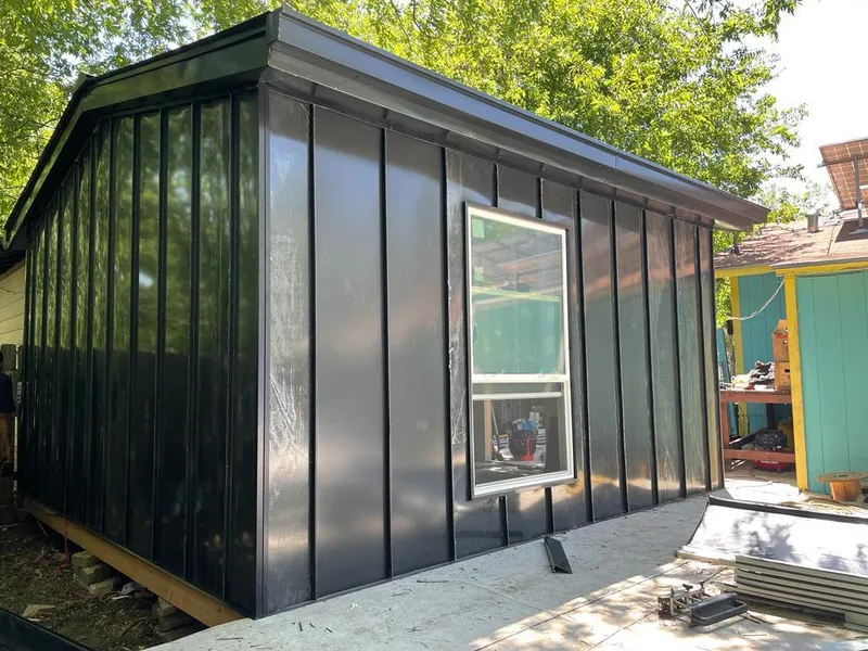 Black standing seam metal wall panels for Roof Inspection in Riga