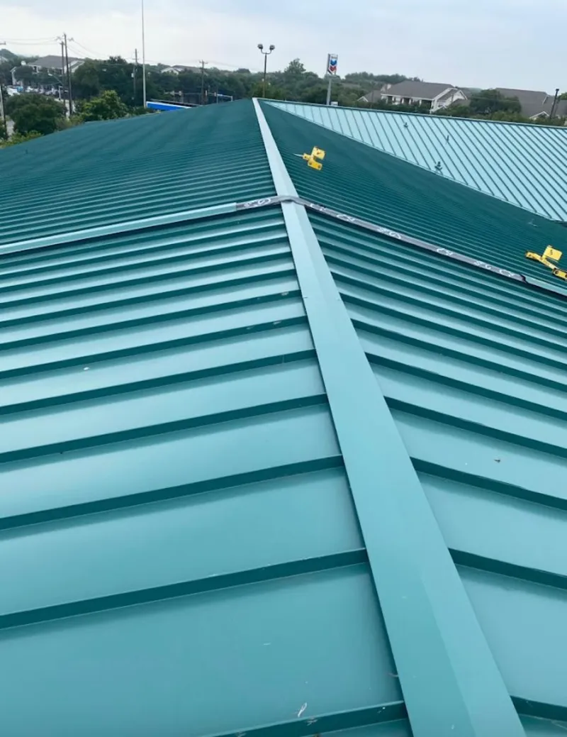 Green commercial metal roof ridge and valley for Metal Roof Repair in Riga
